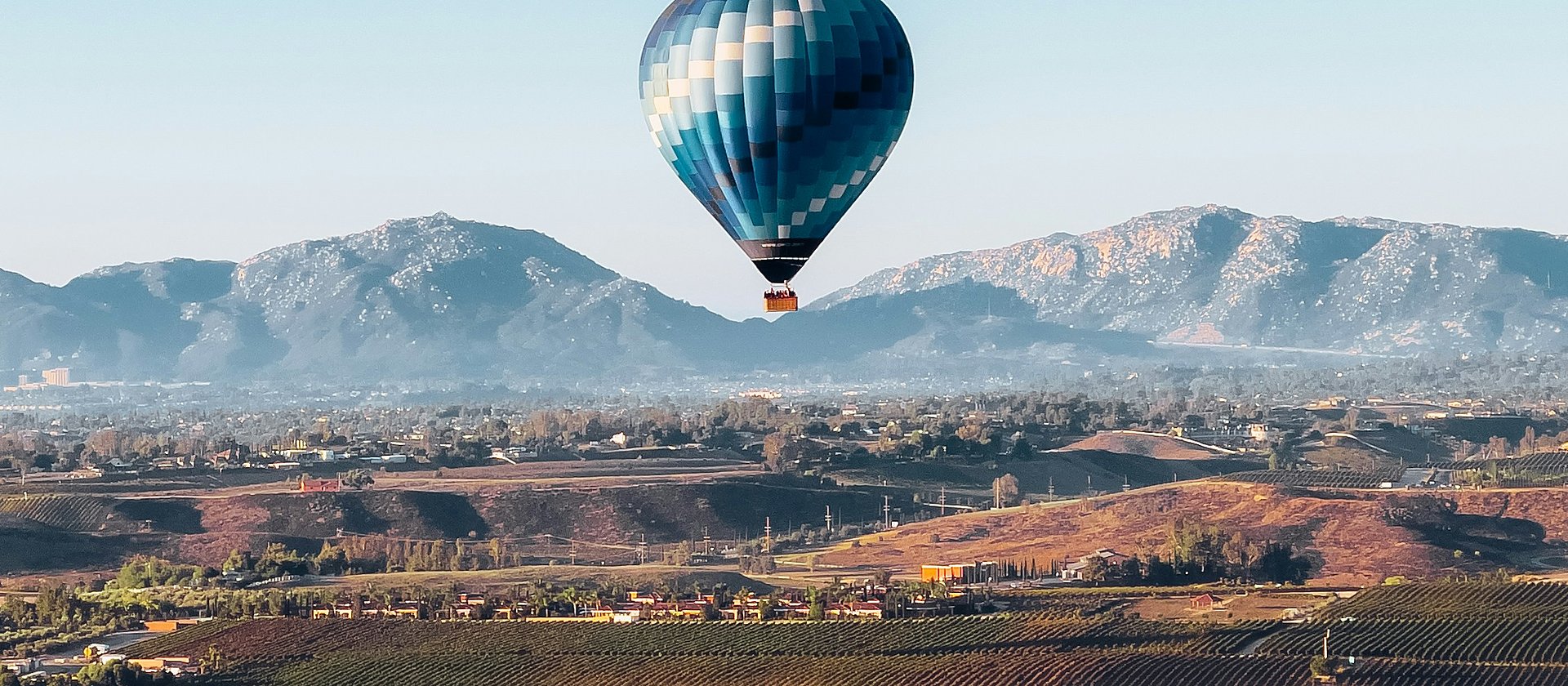 Hot air balloon over Temecula wine country vineyards in Riverside County