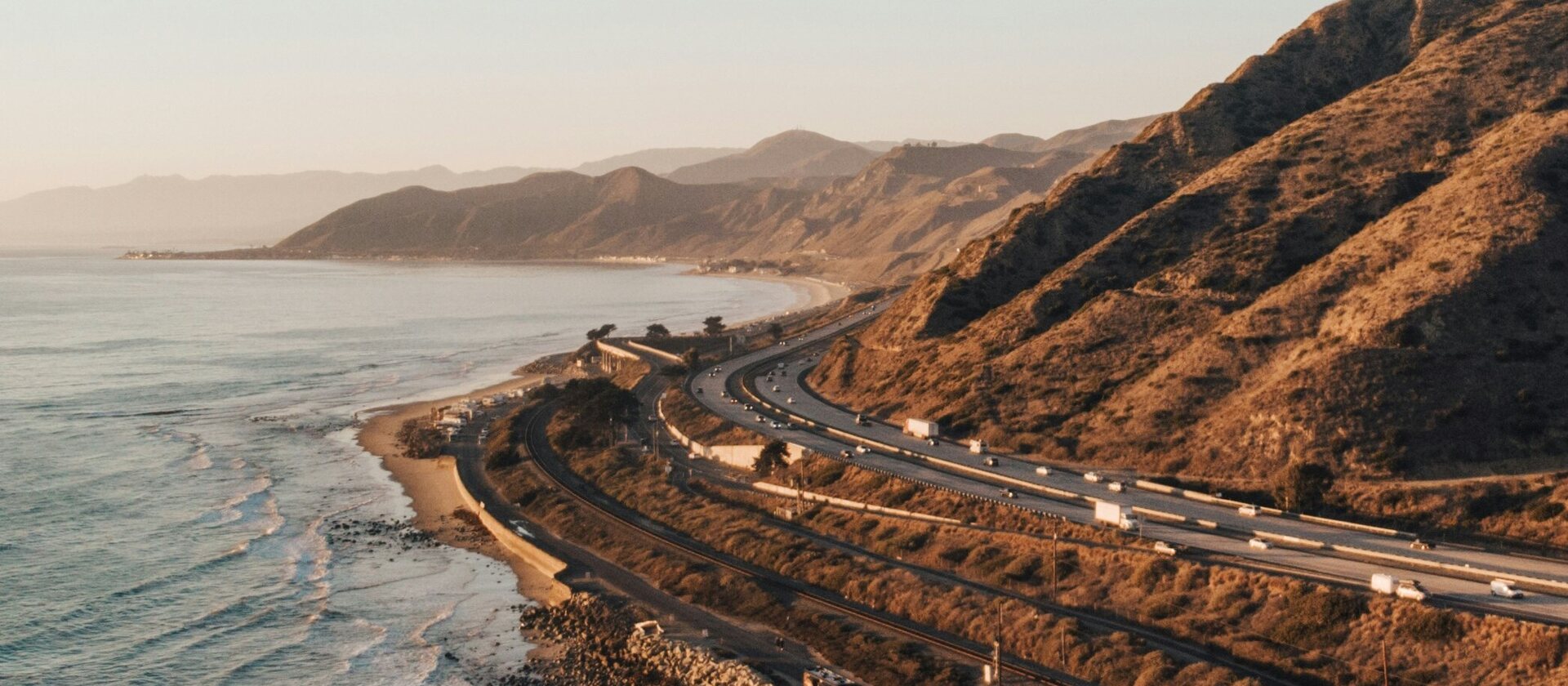 Highway 101 curving along the Ventura County coastline at sunset
